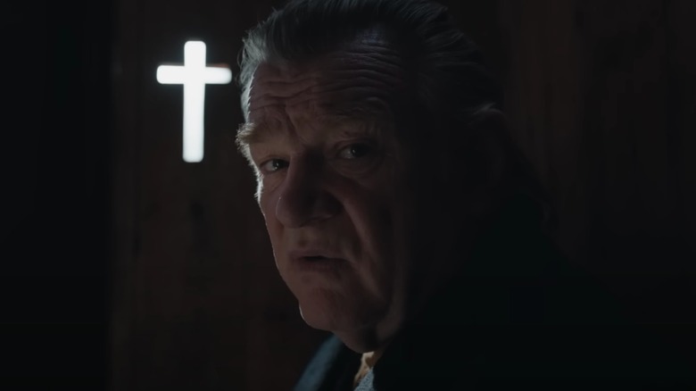Brendan Gleeson as Colm in confession booth Banshees of Inisherin 
