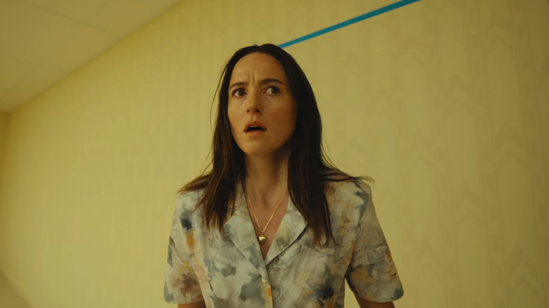 Renate Reinsve's Dr. Mary Kline looks worried as she stands in the Backrooms in Backrooms