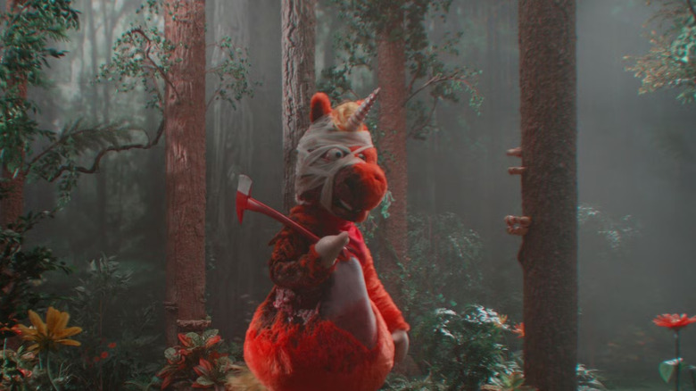 Buddy (2026) - Buddy scarred and bandaged holding axe, walking through forest