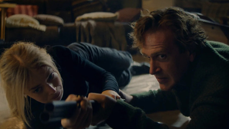 Lisa and Dan both reached for the gun in Over Your Dead Body