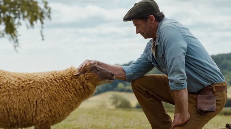 Hugh Jackman as George Hardy shares a moment with Lily the sheep, voiced by Julia Louis-Dreyfus, in The Sheep Detectives