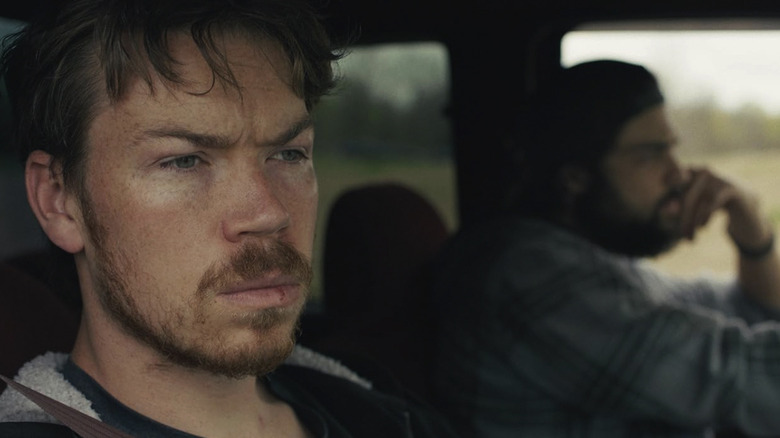 Cody and Jack riding in a car together with scowling faces in Union County