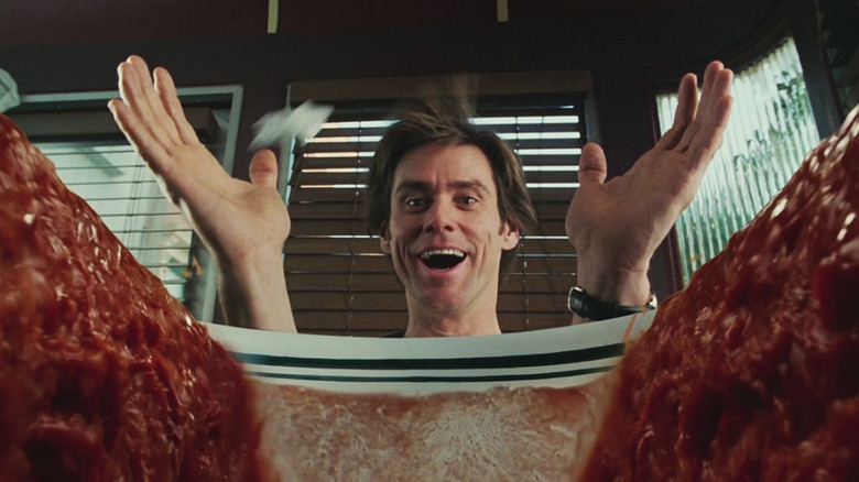 Jim Carrey as Bruce Nolan parting the seas of his tomato soup in a diner in Bruce Almighty.