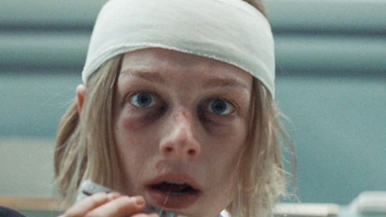 A bandaged Gretchen (Hunter Schafer) holds a pocket knife in Cuckoo (2024)