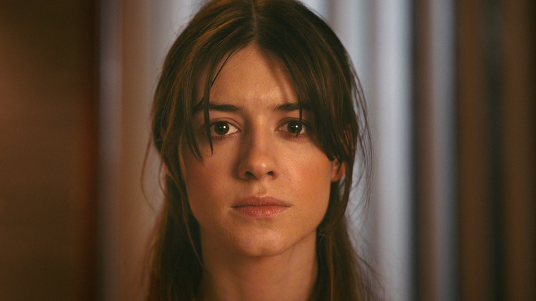 Noa (Daisy Edgar-Jones) stares ahead stoically in Fresh (2022)