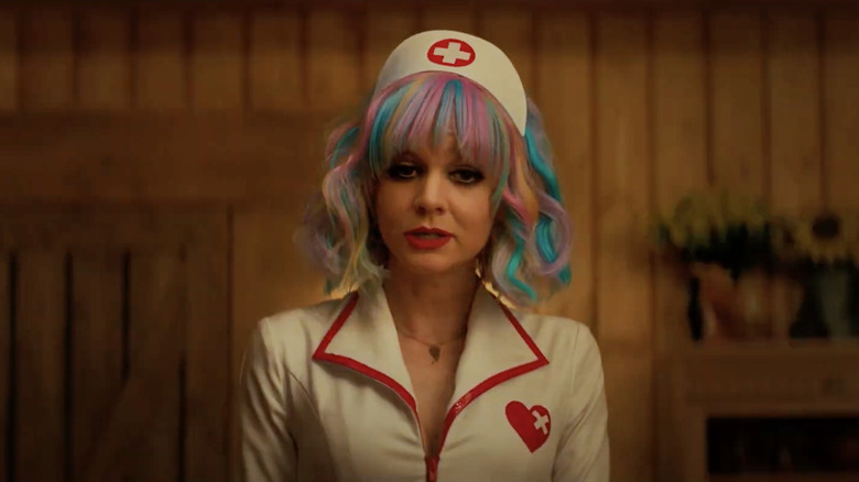 Cassie Thomas (Carey Mulligan) speaks in a nurse costume in Promising Young Woman