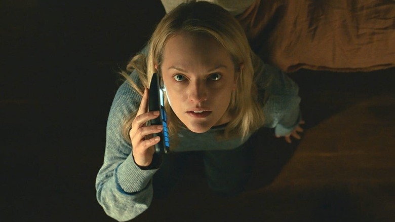 Cecilia Kass (Elisabeth Moss) looks up while on the phone in The Invisible Man (2020)