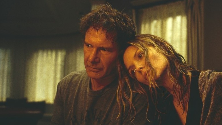 Claire Spencer (Michelle Pfeiffer) rests her head on the shoulder of Norman (Harrison Ford) in What Lies Beneath