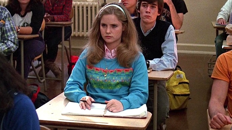 Jennifer Jason Leigh sits in a classroom as Stacy Hamilton in Fast Times at Ridgemont High