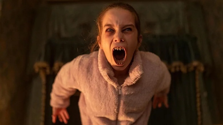 Alisha Weir's Abigail baring her teeth in Abigail