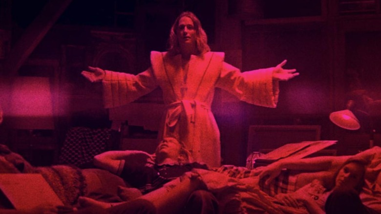 Jeremiah Sand (Linus Roache), in plush bathrobe, just before he shows a lot of himself in Mandy