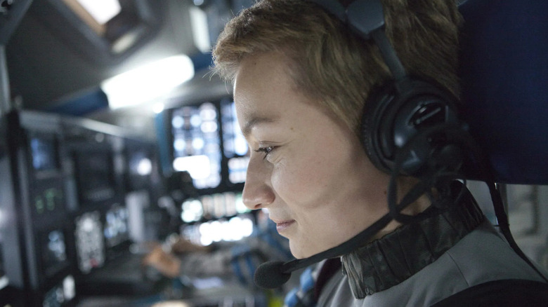 Rosa Dasque (Anamaria Marinca) smiles while examining monitors in Europa Report
