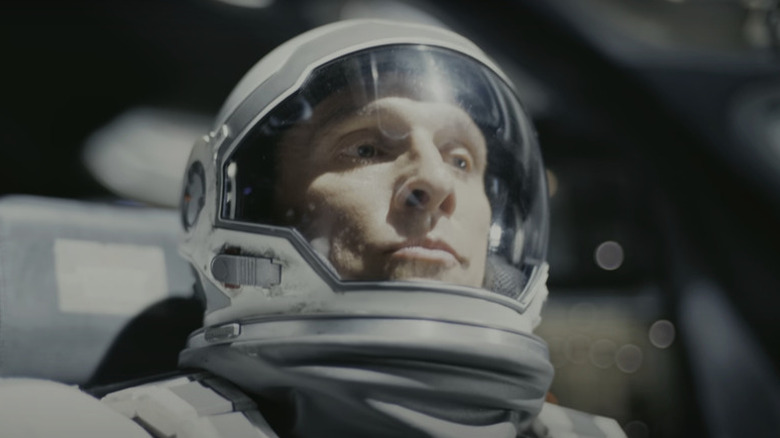 Joseph Cooper (Matthew McConaughey) purses his lips while wearing a spacesuit in Interstellar