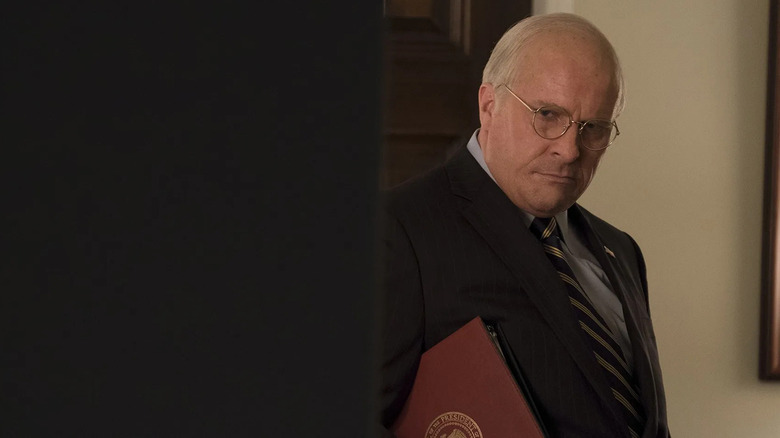 Vice President Cheney holding a binder in Vice (2018)