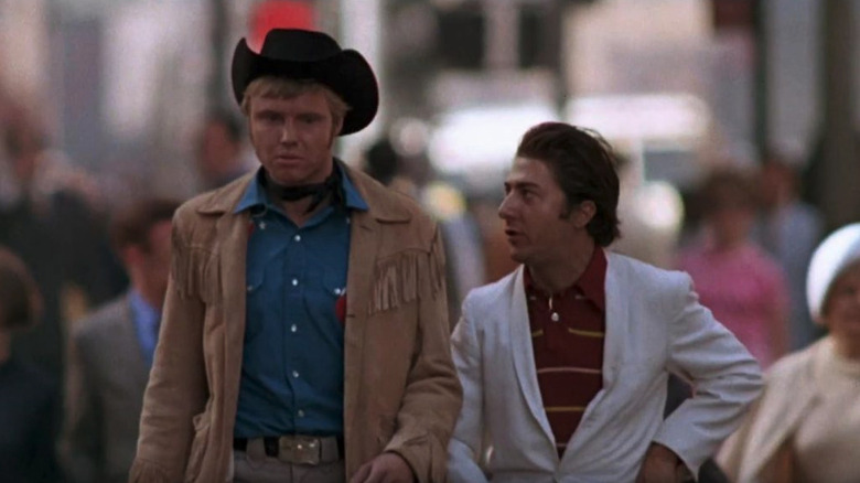 Jon Voight and Dustin Hoffman as Joe and Ratso walking through the city in Midnight Cowboy