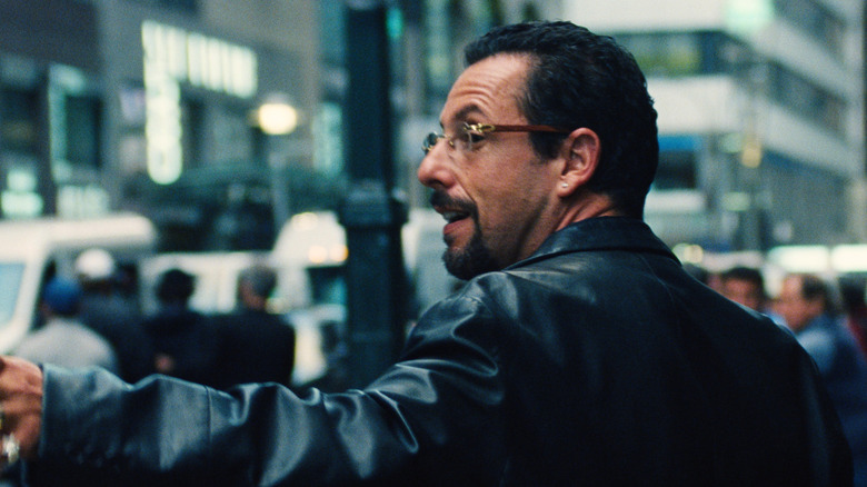 Adam Sandler as Howard Ratner looking behind him in Uncut Gems