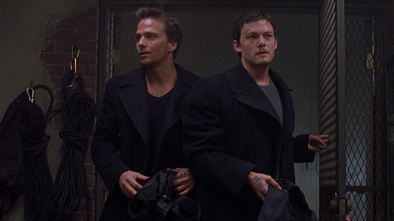 Murphy MacManus (Norman Reedus) and Conner MacManus (Sean Patrick Flannery) in gun room in The Boondock Saints
