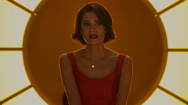 Charlotte (Allison Williams) surrounded by lights in The Perfection
