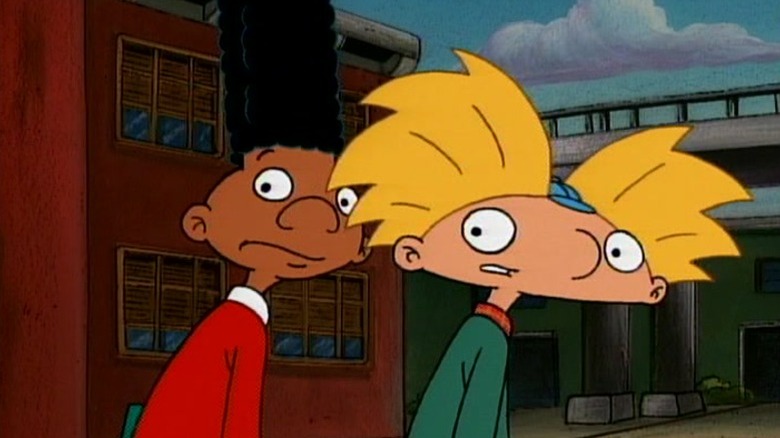 Gerald and Arnold looking behind them while walking down the street on Hey Arnold!