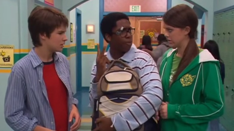 Cookie speaking while Ned and Moze listen worriedly on Ned's Declassified School Survival Guide