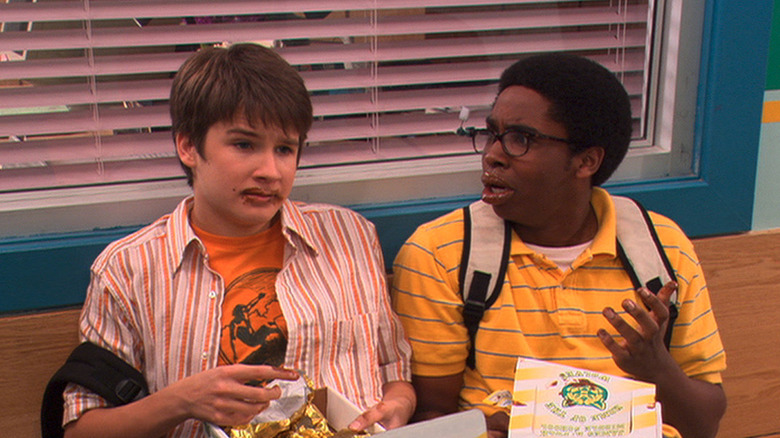 Ned and Moze look worried with chocolate melted on their face in Ned's Declassified School Survival Guide