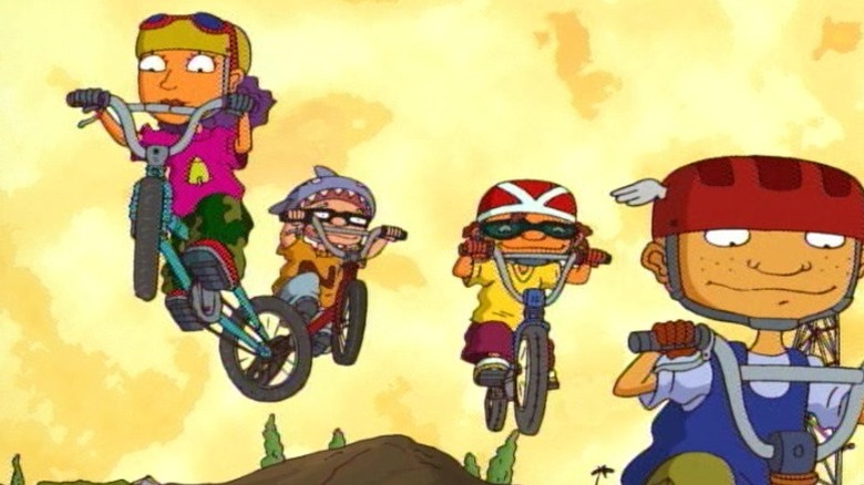 Reggie, Squid, Otto, and Twister biking over a hill on Rocket Power