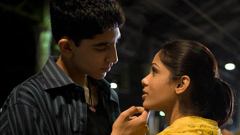 Dev Patel as Jamal Malik and Freida Pinto as Latika in Slumdog Millionaire.