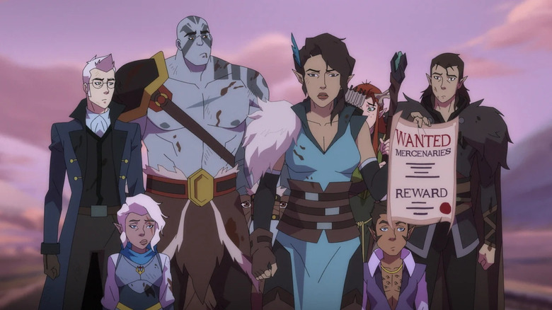 The band of mercenaries at the heart of The Legend of Vox Machina, standing together with a wanted poster, in the animated series.