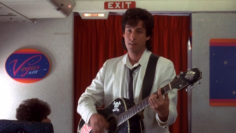 Adam Sandler as Robbie Hart performs an original song in The Wedding Singer