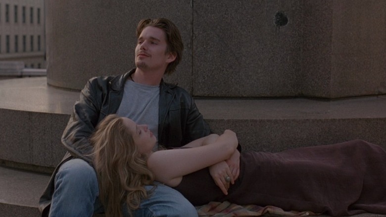 Julie Delpy as Céline lying on the lap of Ethan Hawke as Jesse in Before Sunrise