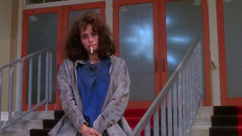 Veronica Sawyer (Winona Ryder) with a cigarette in her mouth in Heathers