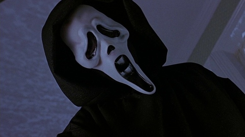 Ghostface standing in a living room in Scream