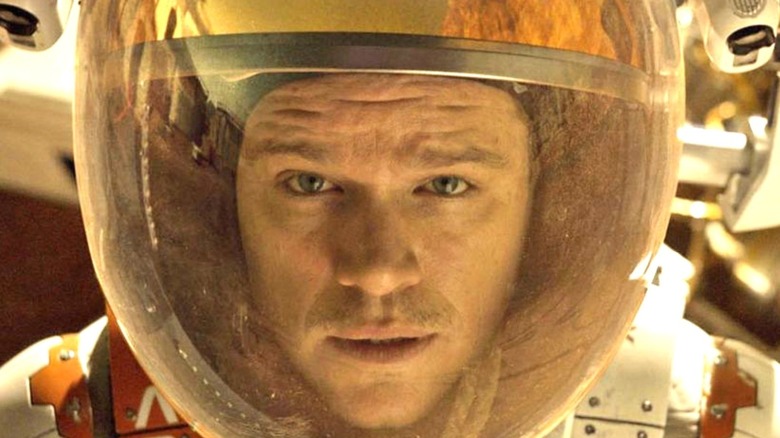 Matt Damon as Mark Watney, in closed environmental space suit, wearing the famous fishbowl helmet.