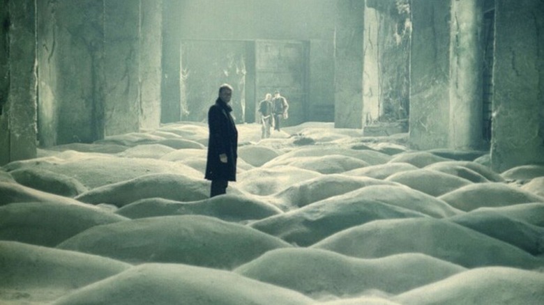 The Stalker (Alexander Kaidanovsky) and his clients in an eerie section of the Zone in Tarkovksy's Stalker
