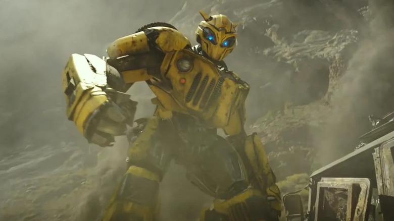 Bumblebee (Dylan O'Brien) stands transformed in Bumblebee