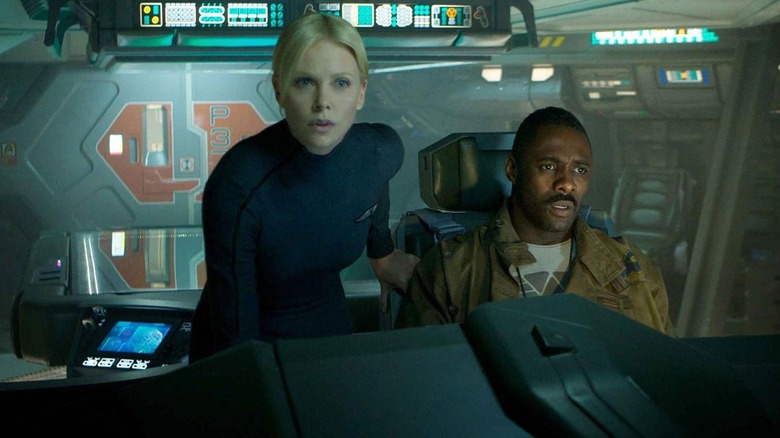 Meredith Vickers (Charlize Theron) and Janek (Idris Elba) look over a spaceship console in Prometheus (2012)