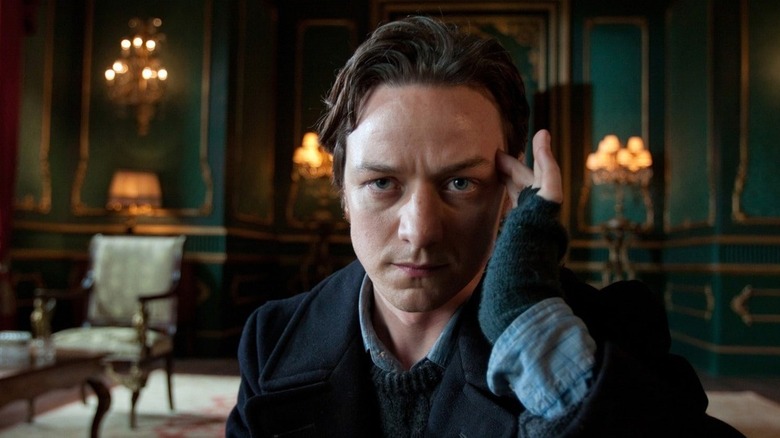 Charles Xavier (James McAvoy) holds his hand to his temple while concentrating in X-Men: First Class