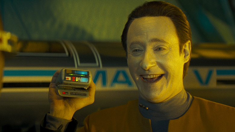 Data laughing with a tricorder in Star Trek: Generations