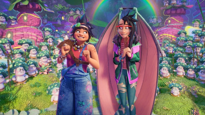 H.E.R. as Jo standing next to Liza Soberano as Raissa on a hill surrounded by an army of characters in Forgotten Island