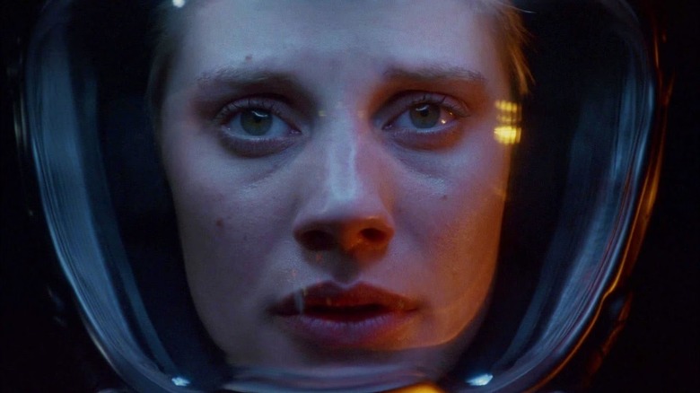 Starbuck (Katee Sackhoff) stares into space from inside her helmet on Battlestar Galactica