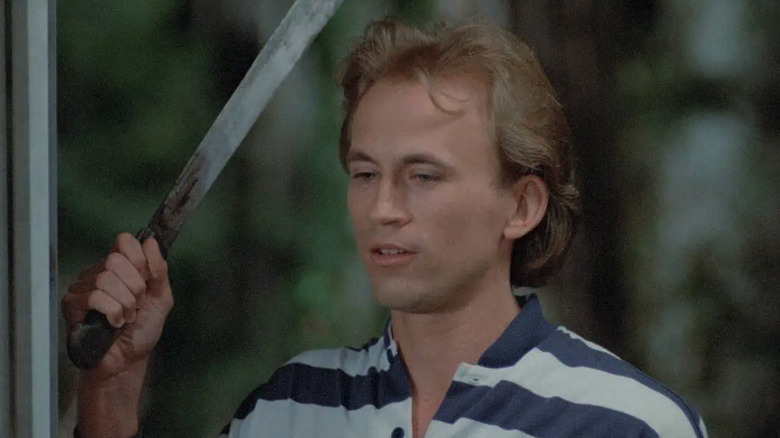 Todd (Mark Soper) holds a machete in Blood Rage
