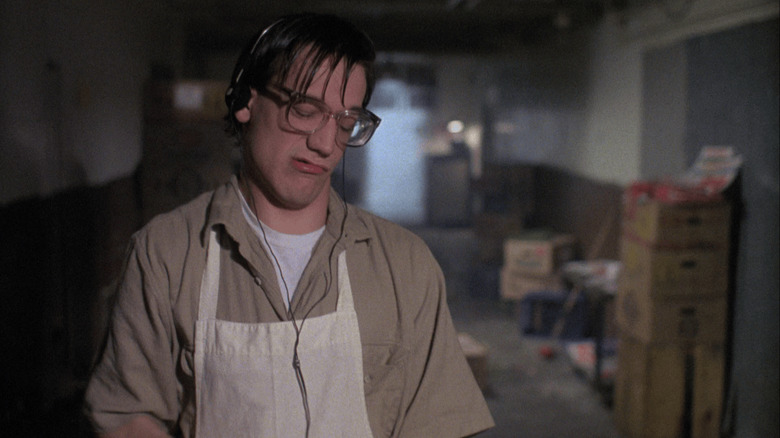 Ted Raimi listening to music and chopping meat