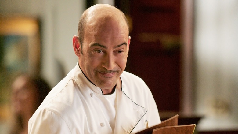 John Vantimiglia as Artie Bucco in a chef's coat in The Sopranos