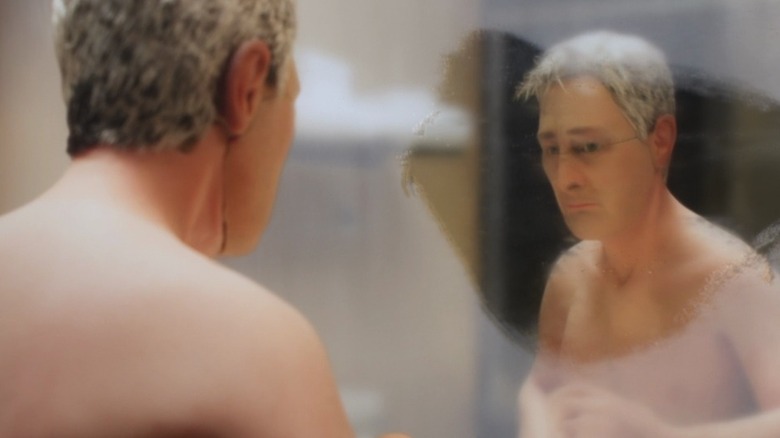 Michael Stone (David Thewlis) looking at himself in a fogged-up mirror in Anomalisa