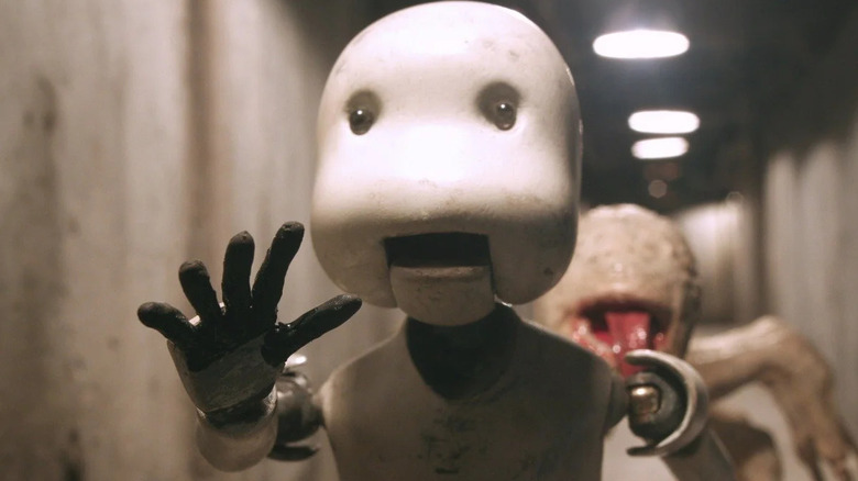 The protagonist running away from a monster in Junk Head