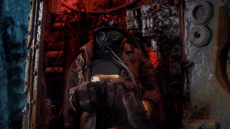 Masked figure holding a map in Mad God