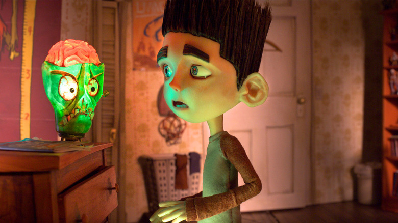 Norman (Kodi Smit-McPhee) looking at a zombie lamp in ParaNorman
