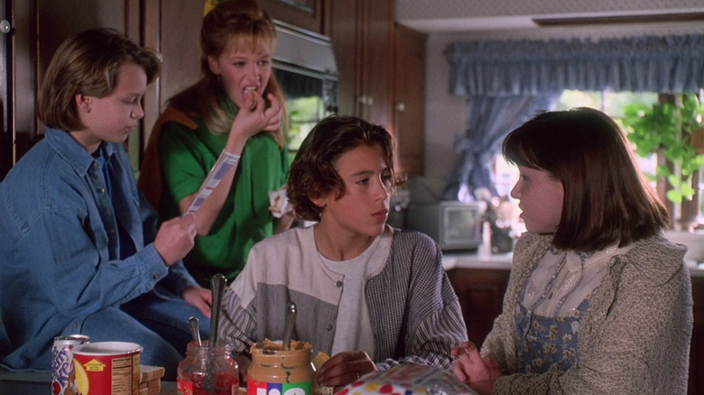Jonathan Jackson as Mud, Marnette Patterson as Trish, Andrew Keegan as Zack, and Melody Kay as Gaby in a kitchen in Camp Nowhere