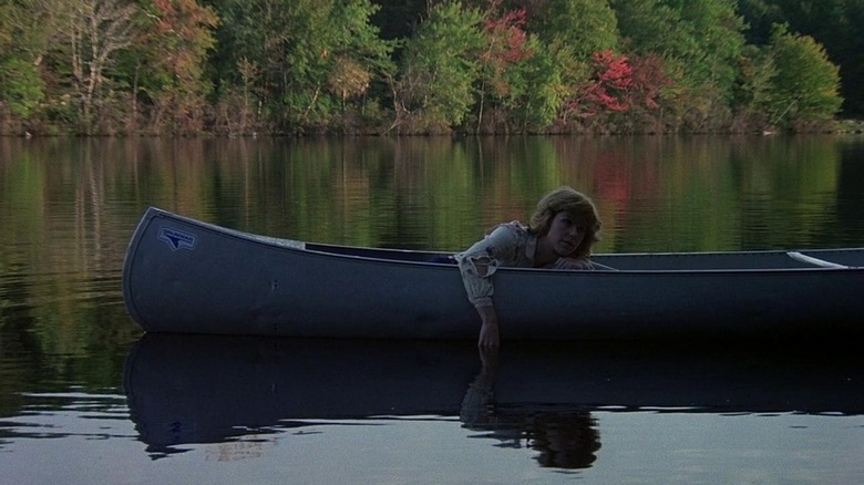 Alice (Adrienne King) rides in a boat in Friday the 13th