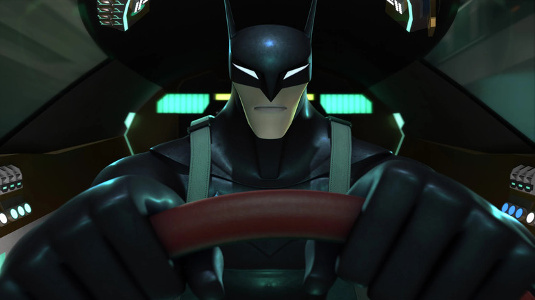 Batman sitting behind the wheel of the batmobile in Beware the Batman.